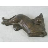 A contemporary bronze-effect recumbent c