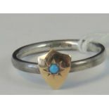 A silver and yellow metal ring, yellow m