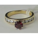 A yellow metal ruby and diamond ring, ce