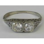 A carved head diamond ring, two 0.25ct a
