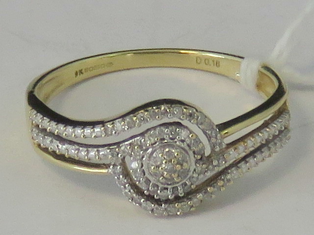 A 9ct gold diamond encrusted twist desig