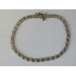 A 9ct gold and diamond tennis bracelet,