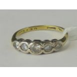 An 18ct gold and five stone diamond ring