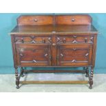 A c1930s oak sideboard, two drawers over