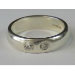 A HM silver and diamond ring, two 0.06ct