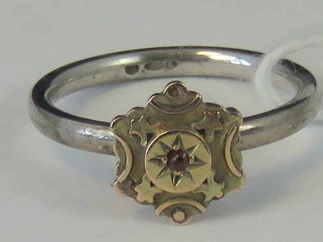 A silver and yellow metal ring, yellow m