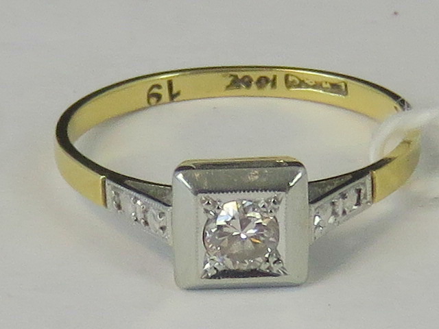 An 18ct gold and diamond solitaire ring,