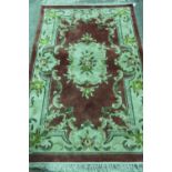 A fine quality Chinese silk rug, red gro