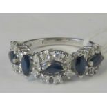 A white metal sapphire and diamond ring,