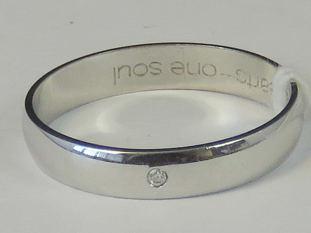 A 9ct white gold and diamond band, diamo