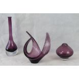 Three heavy amethyst glass items being t