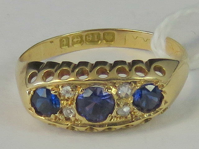 An 18ct gold sapphire and diamond ring,