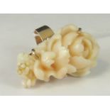 A 14ct gold carved 'angel skin' coral ri