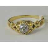 A yellow metal and diamond gypsy ring, d