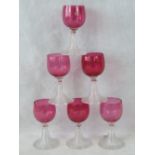 A set of six cranberry wine glasses with