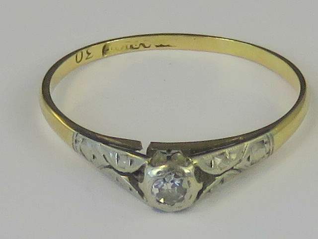 A gold and platinum diamond solitaire ring,