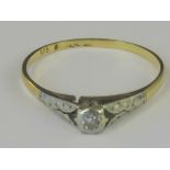 A gold and platinum diamond solitaire ring,