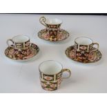 Three traditional Imari pattern Royal Crown Derby coffee cans,