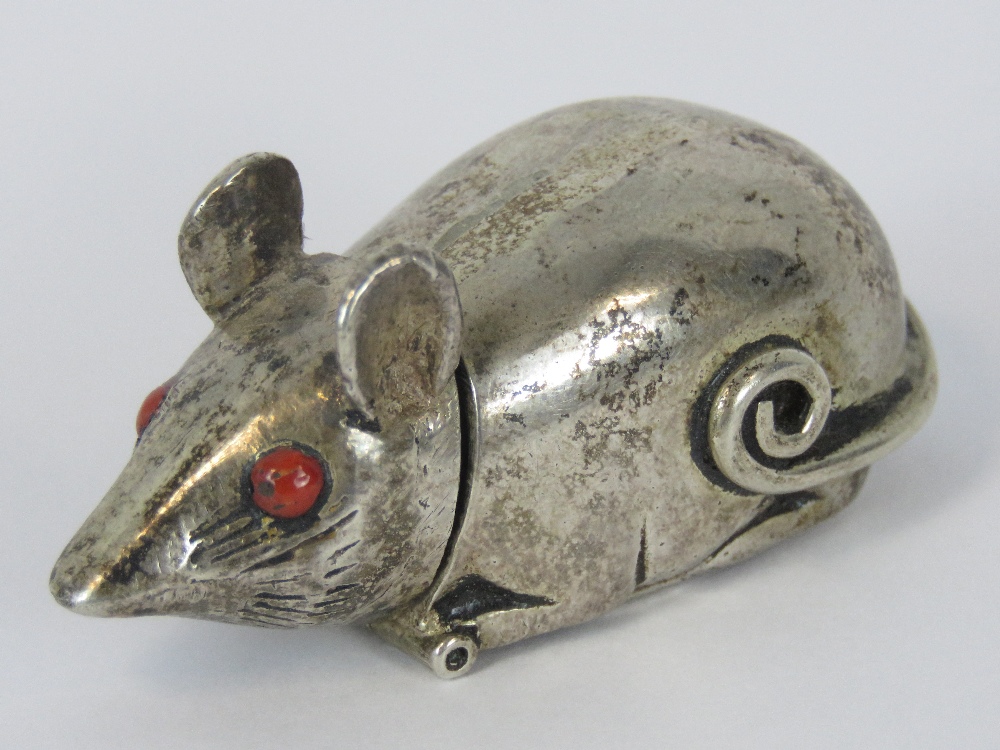 A silver vesta case in the form of a mouse, red glass eyes, stamped 925, 4.8cm long, 50.5g.