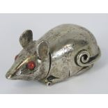 A silver vesta case in the form of a mouse, red glass eyes, stamped 925, 4.8cm long, 50.5g.