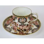 A Royal Crown Derby coffee can with saucer in the King's pattern.