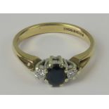 A 9ct three stone sapphire and diamond ring,