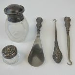 A group of HM silver dressing table items; cut glass scent bottle with stopper and silver lid,