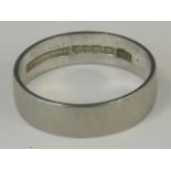 An 18ct white gold band, hallmarked London 18ct, size N, 3.