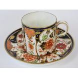 A 1920s Royal Crown Derby coffee can and saucer in orange blue and gold, pattern 6041.