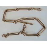 A 9ct rose gold Albert chain with dog clasp and T bar, hallmarked 375 in various places, 44.