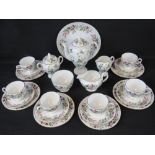 A six-piece Wedgwood Hathaway Rose tea set comprising six trips, cake plate,