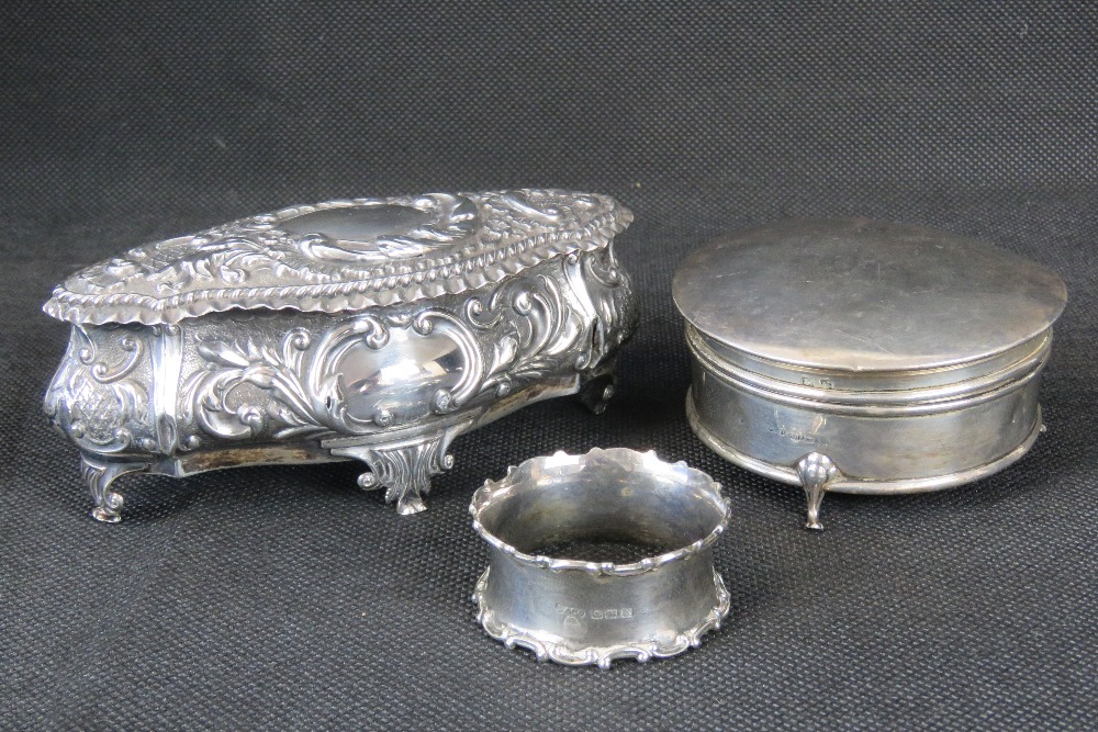 Two HM silver trinket boxes; one with repoussé floral design hallmarked Birmingham 1902, 3.