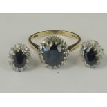 A 9ct gold sapphire and diamond ring with unmarked earrings to match.