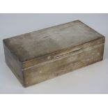 A HM silver cedarwood lined cigarette box, complete with internal divider,