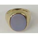 A 9ct gold chalcedony signet ring, unengraved oval chalcedony set in yellow metal hallmarked 375,