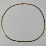 A 9ct gold, flattened curb link chain, 52cm in length, 14.
