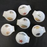 Seven French Apilco porcelain gilded and scalloped side dishes.