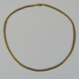 A 9ct gold, flattened curb link chain, 44cm in length, 13.