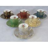 A cased set of Minton Brocade coffee cans with saucers in red, dark blue, cream, cobalt blue,