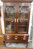 AN 18TH.C.MAHOGANY BOOKCASE CABINET ON STAND FITTED WITH FIVE DRAWERS