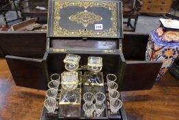 A VICTORIAN EBONISED AND BOULLE WORK TANTALUS CABINET