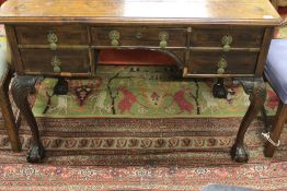 AN 18TH.C.STYLE WALNUT FIVE DRAWER WRITING TABLE N CABRIOLE LEGS