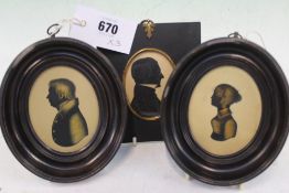 A PAIR OF GILT HIGHLIGHTED OVAL MINIATURE SILHOUETTE PORTRAITS IN MOULDED FRAMES AND ANOTHER IN AN