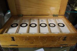 A CASED OF MICROSCOPE SLIDES
