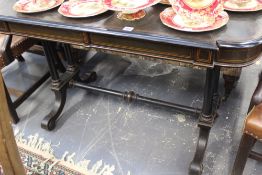 A VICTORIAN EBONISED CENTRE TABLE