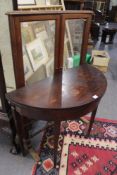 AN EARLY 19TH.C.MAHOGANY FOLD OVER CARD TABLE TOGETHER WITH A VICTORIAN FOLDING SCREEN.