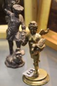 AN 18TH/19TH.C.BRONZE FIGURE OF A WINGED CHERUB WITH DUCK TOGETHER WITH A SILVERED FIGURE ST.