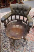 A VICTORIAN MAHOGANY AND LEATHER UPHOLSTERED SWIVEL OFFICE CHAIR