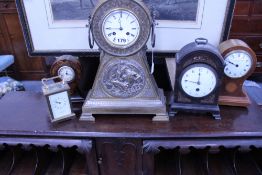 A VICTORIAN GILT BRASS MANTLE CLOCK WITH RELIEF PANEL DEPICTING OLD FATHER TIME TOGETHER WITH FOUR