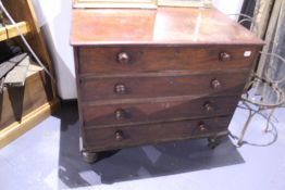 A LATE GEORGIAN MAHOGANY BATCHELOR'S CHEST OF FOUR LONG DRAWERS IN THE MANNER OF GILLOWS